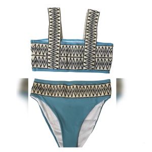 2- piece bathing suit in Size Medium. Cute detailing.. New without  tag.
